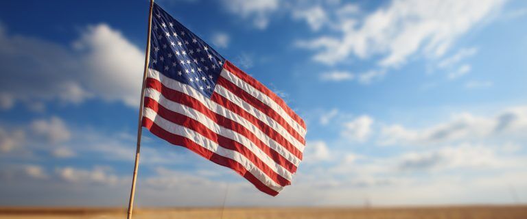 Here’s the AI description for the alt tag but it’s not the final name yet—please check the naming we usually do for images: US flag waving on a sunny day (AI)